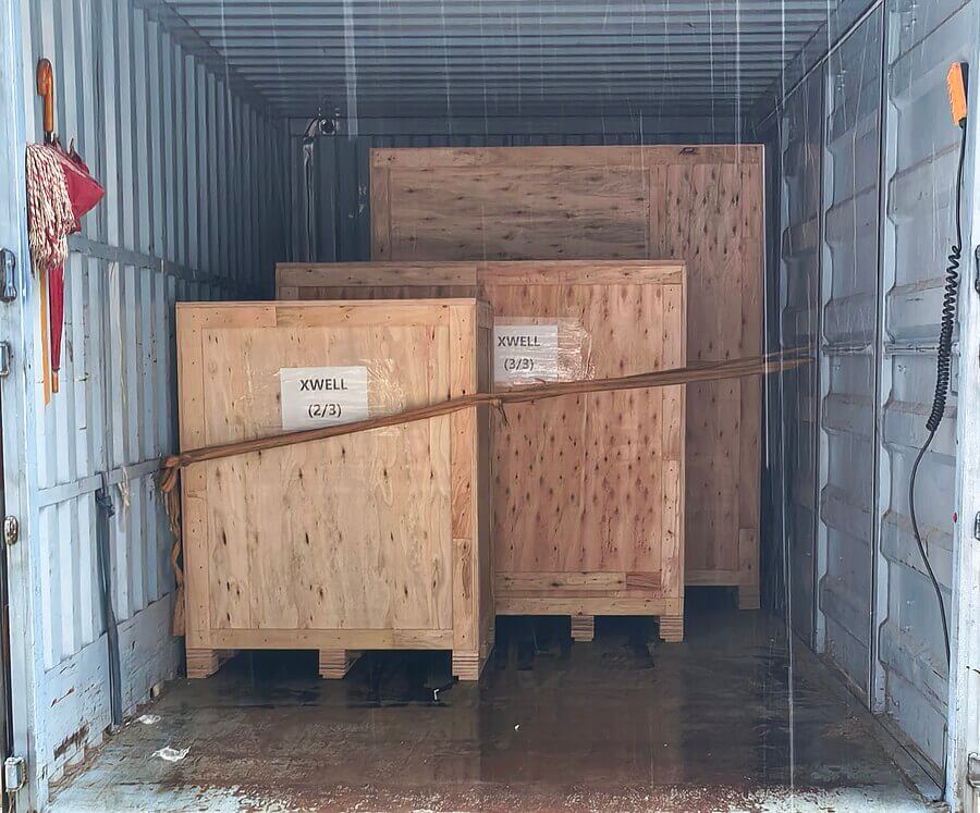 Wooden cases loaded with XWELL battery equipment for shipment to India